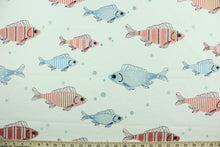 Load image into Gallery viewer, This cute and fun fabric features fish embroidered in shades red and blue against a white background.  Uses include drapery, pillows, light upholstery, table runners, bedding, headboards, home décor and apparel.  
