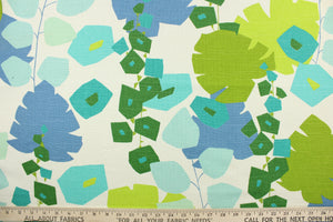 This fabric features a bold floral design in green, blue, light turquoise , teal and dull white. 