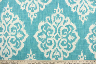 This fabric features an ikat damask design in a beautiful Caribbean blue and a dull white. 