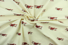 Load image into Gallery viewer, This cute and fun fabric features vintage biplanes embroidered in red and gray against a light beige background. Uses include drapery, pillows, light upholstery, table runners, bedding, headboards, home décor and apparel.  
