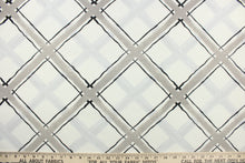 Load image into Gallery viewer, This fabric features a diagonal plaid design in black and gray against a white background .
