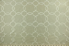 Load image into Gallery viewer, This fabric features a large geometrical design beige.  The embroidered design adds an elegant look to the fabric.  Uses include window treatments, accent pillows, bedding, cornice boards and home décor.
