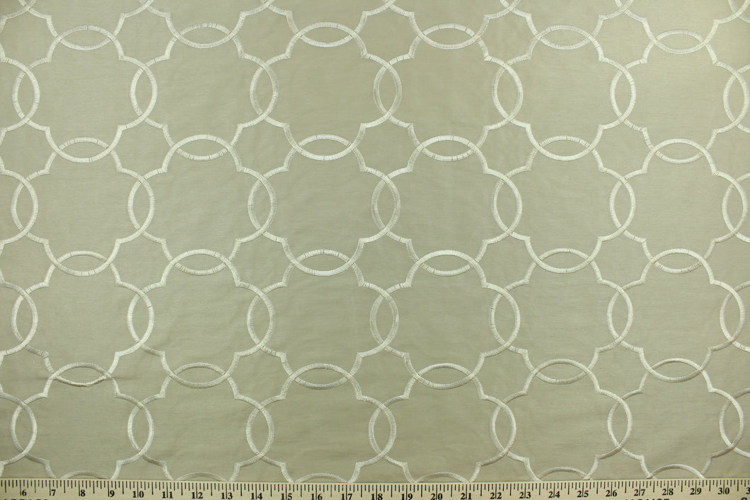This fabric features a large geometrical design beige.  The embroidered design adds an elegant look to the fabric.  Uses include window treatments, accent pillows, bedding, cornice boards and home décor.