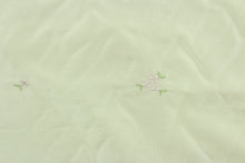 Load image into Gallery viewer, Milky Meadow features a beautiful floral design in pink and green against a tan background with a scalloped edge.  The sheen enhances and adds an elegant look to the fabric.  Uses include window treatments, accent pillows, bedding, cornice boards and home décor.
