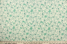 Load image into Gallery viewer, This fabric features a floral design in a dull white and a rich green against a light green. 
