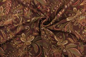 This tapestry features a floral design in gold, green, burgundy, and brown. 