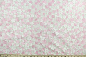 This fabric features beautiful flowers petals in pink and white embroidered on to a white tulle net backing.  The sheer fabric is see through with a nice flowy drape.  It is perfect for special occasion apparel, costumes, overlays, table tops, décor, sheer curtains and more.  
