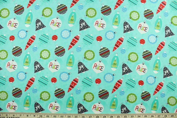 This cheerful holiday print features pretty ornaments outlined in a silver metallic overlay on a turquoise background.   The versatile lightweight fabric is soft and easy to sew.  It would be great for quilting, crafting and sewing projects.  Colors included are red, blue, green and dark gray.