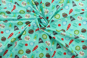 This cheerful holiday print features pretty ornaments outlined in a silver metallic overlay on a turquoise background.   The versatile lightweight fabric is soft and easy to sew.  It would be great for quilting, crafting and sewing projects.  Colors included are red, blue, green and dark gray.