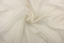 Load image into Gallery viewer, This sheer fabric features a stripe design in a tan, white, beige, and black.
