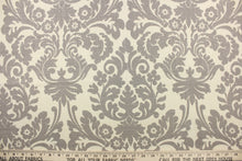 Load image into Gallery viewer, This fabric features a demask design in gray against a natural background .
