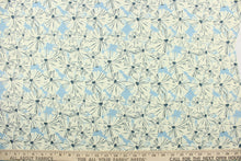 Load image into Gallery viewer, This fabric features a floral design in creamy white and dark blue against a light blue background.
