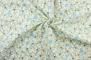 This fabric features a floral design in creamy white and dark blue against a light blue background.
