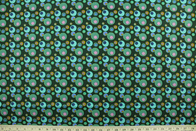 This screen printed fabric features vintage bubbles in shades of green, pink, blue, purple yellow and orange against a dark green background.  The versatile lightweight fabric is soft and easy to sew.  It would be great for quilting, crafting and sewing projects.  