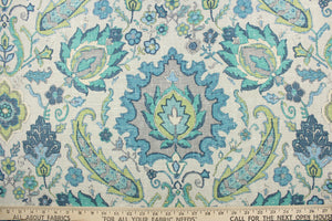 This fabric features a damask floral design in lime green, turquoise, teal, blue, and gray against a taupe background