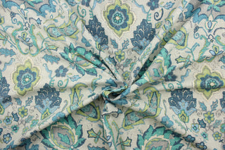 This fabric features a damask floral design in lime green, turquoise, teal, blue, and gray against a taupe background