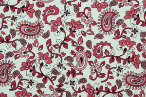 Scripture features a floral and paisley print in shades of rose against a white background.  The versatile lightweight fabric is soft and easy to sew.  It would be great for quilting, crafting and sewing projects.  