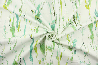 This fabric features a abstract watercolor vine and bird design in green, turquoise, gray, black and lime green against a dull white . 