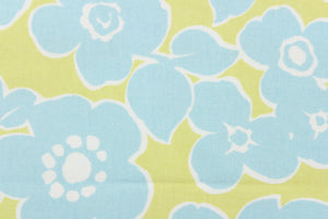 The mineral offers a light blue floral outline in white set against a light lime green. 