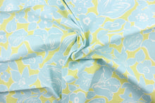 Load image into Gallery viewer, The mineral offers a light blue floral outline in white set against a light lime green. 
