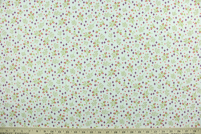 Gathering Rosebud is a screen printed floral design fabric featuring tiny pink rosebud stems and purple stars against a white background.  The versatile lightweight fabric is soft and easy to sew.  It would be great for quilting, crafting and sewing projects.  