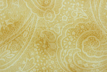 Load image into Gallery viewer, This screen printed fabric features a paisley design in wheat and ivory.  The versatile lightweight fabric is soft and easy to sew.  It would be great for quilting, crafting and sewing projects.  
