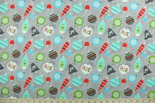 Load image into Gallery viewer, This cheerful holiday print features pretty ornaments outlined in a silver metallic overlay on a gray background.  The versatile lightweight fabric is soft and easy to sew.  It would be great for quilting, crafting and sewing projects.  Colors included are red, blue, green and turquoise.
