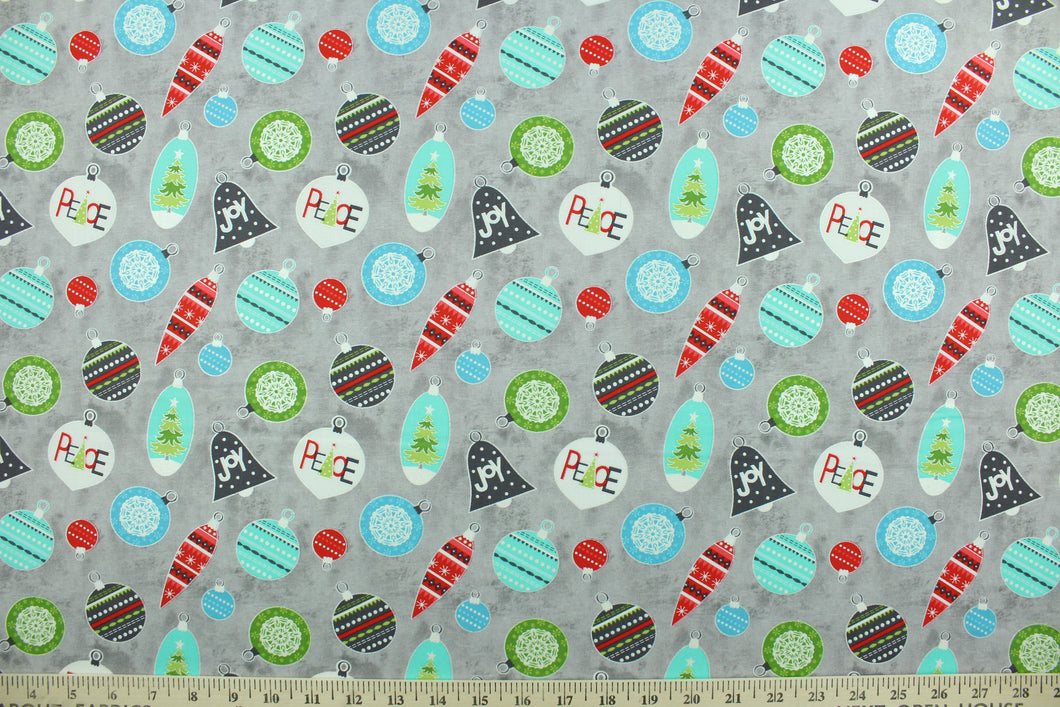 This cheerful holiday print features pretty ornaments outlined in a silver metallic overlay on a gray background.  The versatile lightweight fabric is soft and easy to sew.  It would be great for quilting, crafting and sewing projects.  Colors included are red, blue, green and turquoise.