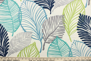 This fabric features a botanical leaf design in gray, turquoise, teal, navy blue, and lime green against a dull white .