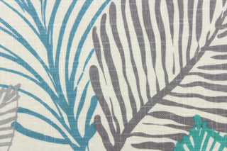This fabric features a botanical leaf design in gray, turquoise, teal, navy blue, and lime green against a dull white .