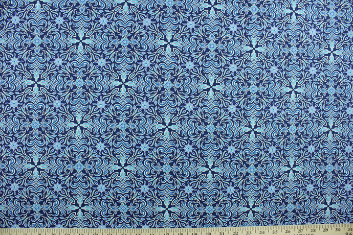 This screen printed fabric features a medallion design in shades of blue and white with hints of purple.  The versatile lightweight fabric is soft and easy to sew.  It would be great for quilting, crafting and sewing projects.  
