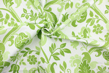 Load image into Gallery viewer,  This fabric features a  large floral vine design with simple colors in varying shades of green flowers on a white background. 
