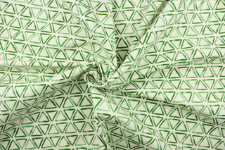 This fabric features a triangle design in green against a dull white background.