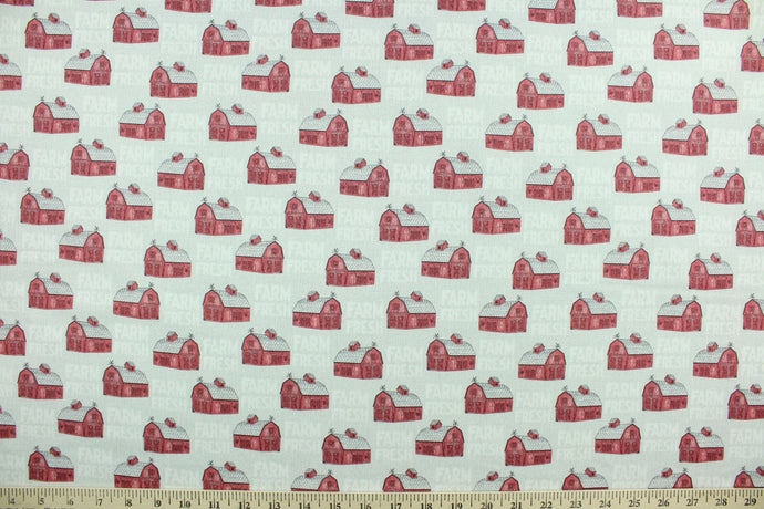 This cheerful fabric features traditional red barns with the words 