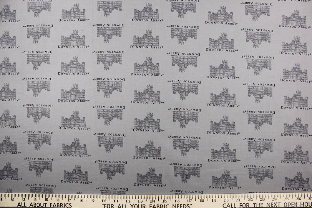  This quilting fabric features a Downtown Abbey print in gray .