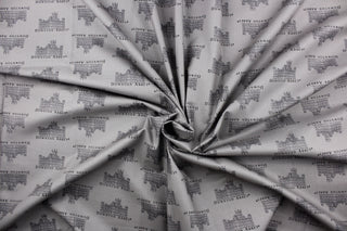  This quilting fabric features a Downtown Abbey print in gray .