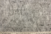 Load image into Gallery viewer, This fabric features a demask design in  varying shades of gray and hints of black against a dull off white.
