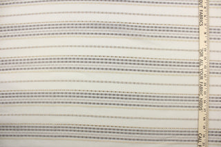  This sheer fabric features a stripe design in silver, cream, gray, and gold against a off white backgrounds. 