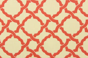 This fabric features a geometric design in a coral or light orange against a cream background.