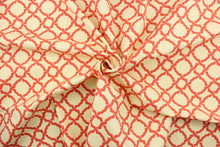 Load image into Gallery viewer, This fabric features a geometric design in a coral or light orange against a cream background.
