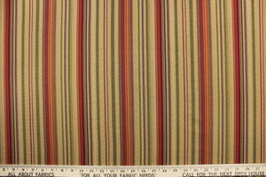 This rich woven yarn dyed fabric features bold multi width striped pattern in rich red, bronze, green, dark beige, and a dark purple. 