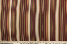 Load image into Gallery viewer, This rich woven yarn dyed fabric features bold multi width striped pattern in burgundy, green, gold, bronze, and beige. 
