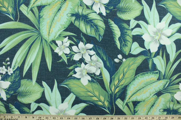 Tahiti features a tropical floral design in gray, white and green set against a navy blue background. It is perfect for any project where the fabric will be exposed to the weather.  Able to resist stains and water, and has a rating of 10,000 double rubs, UV tested and can withstand 500 hours of direct sunlight  Uses include cushions, tablecloths, upholstery projects, decorative pillows and craft projects. This fabric has a slightly stiff feel but is easy to work with.