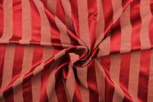 Load image into Gallery viewer, This stunning yarn dyed fabric features a  wide striped pattern in rich red tone.
