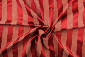 This stunning yarn dyed fabric features a  wide striped pattern in rich red tone.