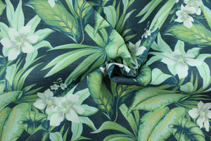 Tahiti features a tropical floral design in gray, white and green set against a navy blue background. It is perfect for any project where the fabric will be exposed to the weather.  Able to resist stains and water, and has a rating of 10,000 double rubs, UV tested and can withstand 500 hours of direct sunlight  Uses include cushions, tablecloths, upholstery projects, decorative pillows and craft projects. This fabric has a slightly stiff feel but is easy to work with.