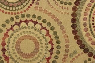 This contemporary geometric design features overlapping circles and dots in red, beige, green, brown, and burgundy.