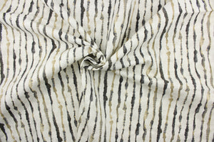 This fabric features a stripe design in black, gray, taupe, and white