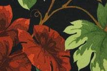 Load image into Gallery viewer, Tropique features beautiful tropical flowers and leaves in red, green, brown and yellow set against a black background.  It is perfect for outdoor settings or indoors in a sunny room.  It is stain and water resistant and can withstand up to 500 hours of direct sun exposure and has a durability rating of 10,000 double rubs.  Uses include decorative pillows, cushions, chair pads, tote bags and upholstery.
