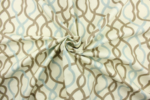 This fabric features a geometric design in light blue and taupe against a off white background. 